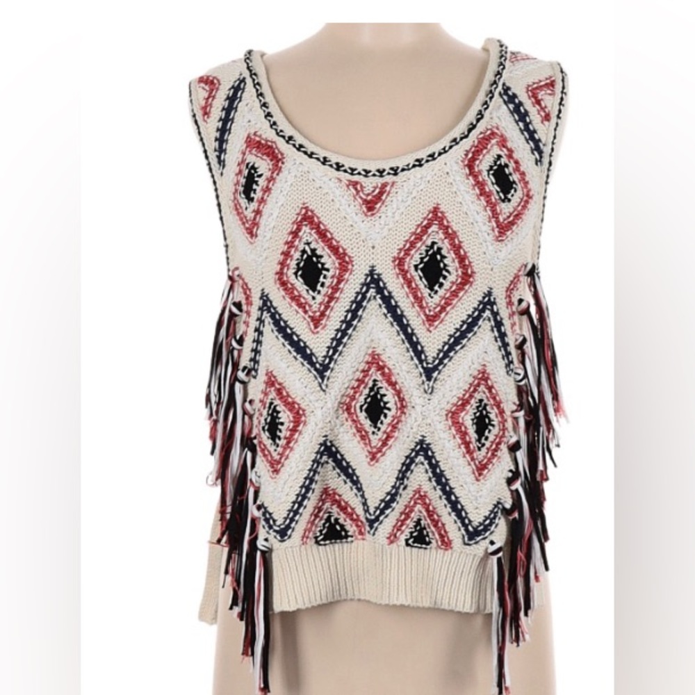 Sleeveless.  Tunic Top.  Scoop Neckline. Color is more ivory than white.